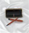 Montblanc #246/#46 (Danish) coral celluloid button-filler fountain pen and mechanical pencil set.